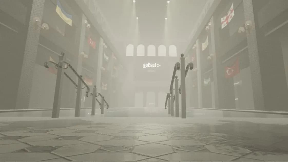 The 2023 bathhouse hall in fog, flags on the balconies, and the goEast logo over the far arches.