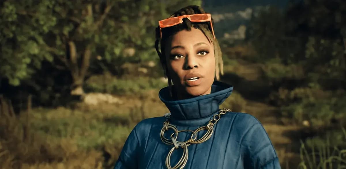 A digital character in a blue puffer jacket and gold chain, orange glasses pushed up, stands in a sunlit forest.