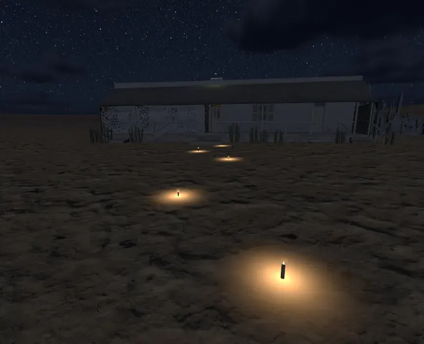 Inside Glass Angels: the Owl House at night under the stars, with lit candles on the sand leading to the front stoep.